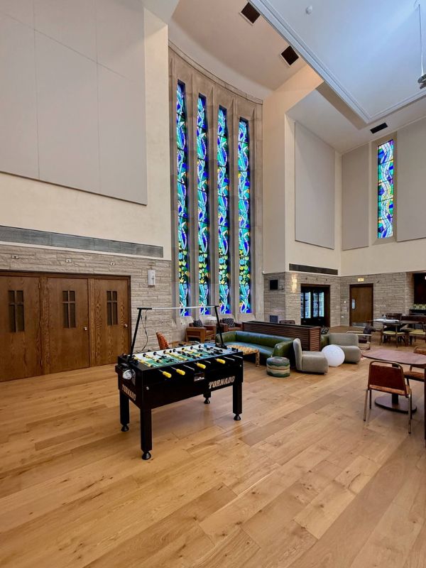 Wide plank hardwood flooring installed in renovated church lounge area at Church of Pickleball in Chicago Illinois